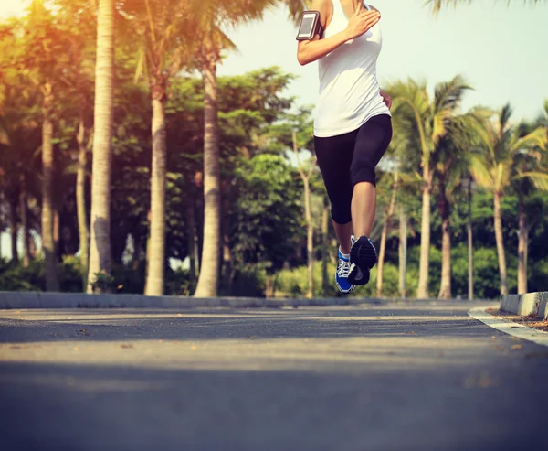 Runner athlete running at tropical park — Stock Photo, Image