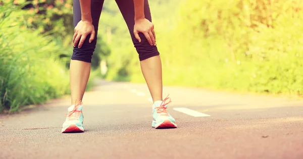 Tired female runner after running — Stock Photo, Image