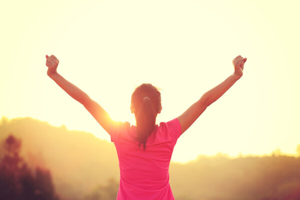 Cheering woman with open arms