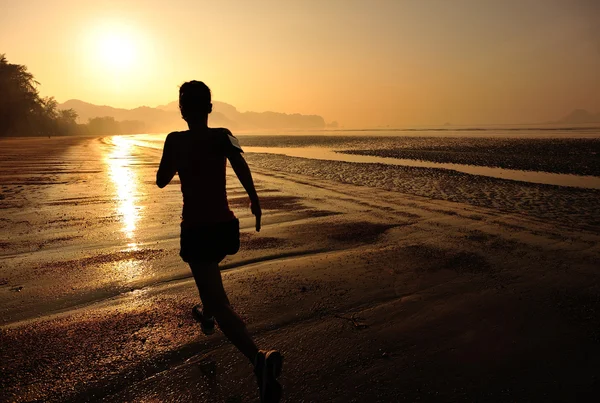 Healthy lifestyle woman running at beach — Stock Photo, Image