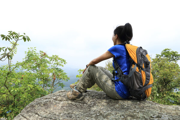 Woman hiker enjoy sunset view