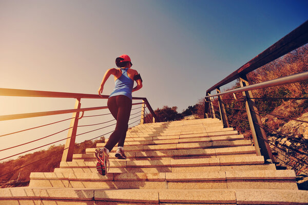 Healthy lifestyle woman running up