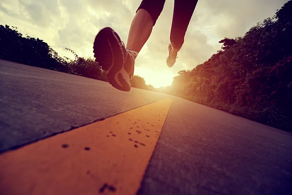 Runner athlete running at seaside road — Stock Photo, Image