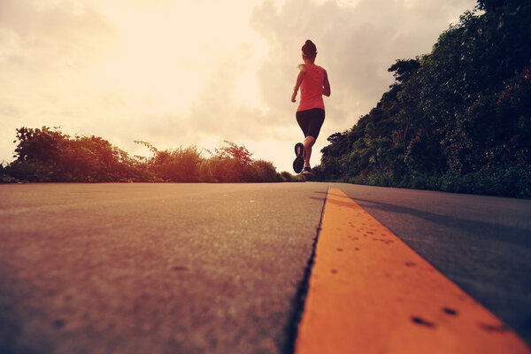 Runner athlete running at seaside