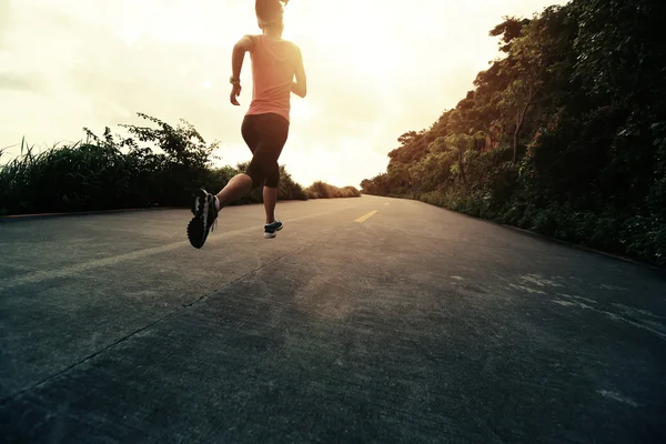 Runner athlete running at seaside road — Stock Photo, Image