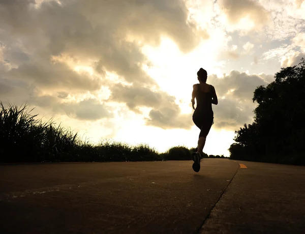 Runner athlete running at seaside road — Stock Photo, Image