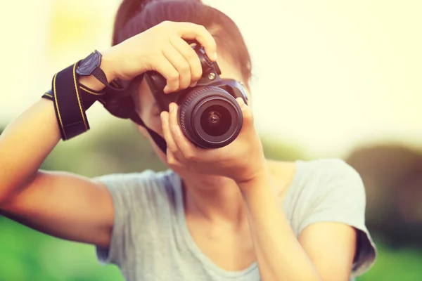 Woman  photographer taking picture Royalty Free Stock Photos