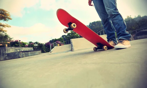 Skateboarder legs at skate park — Stock Photo, Image