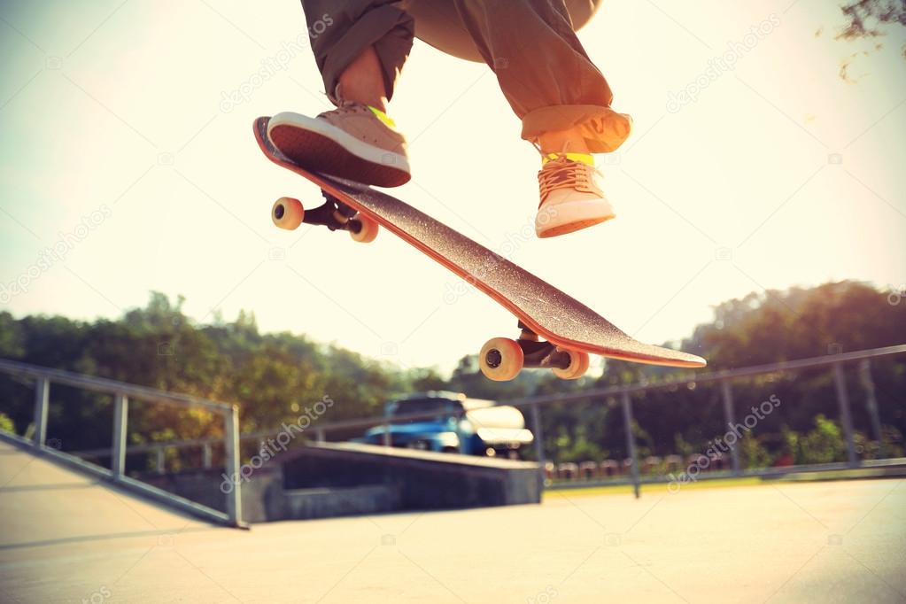 Skateboarder legs at skatepark