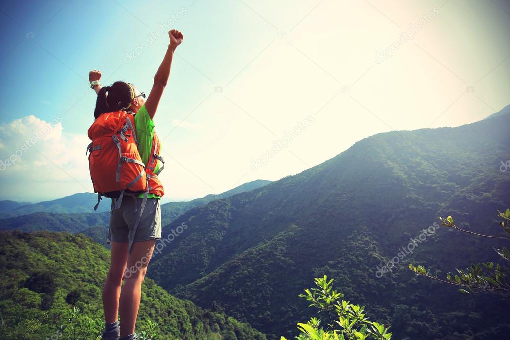 woman hiker at mountain peak