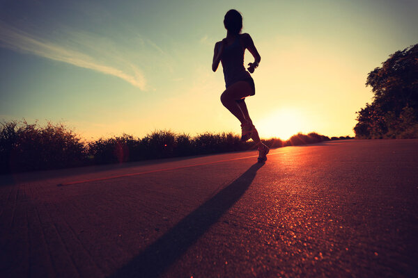 Young fitness woman running