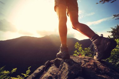 female hiker legs at mountain clipart