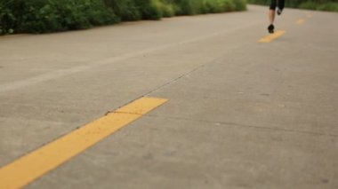 woman running on seaside trail
