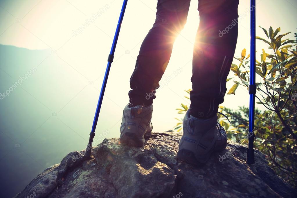 Young woman hiker legs on mountain