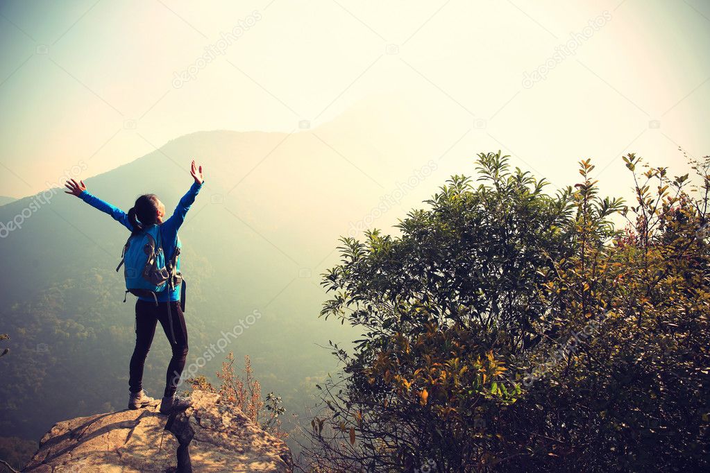 woman hiker  at mountain peak