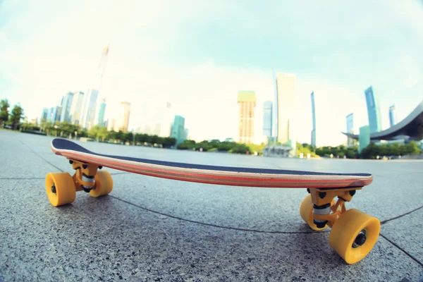 Wooden Skateboard on city — Stock Photo, Image