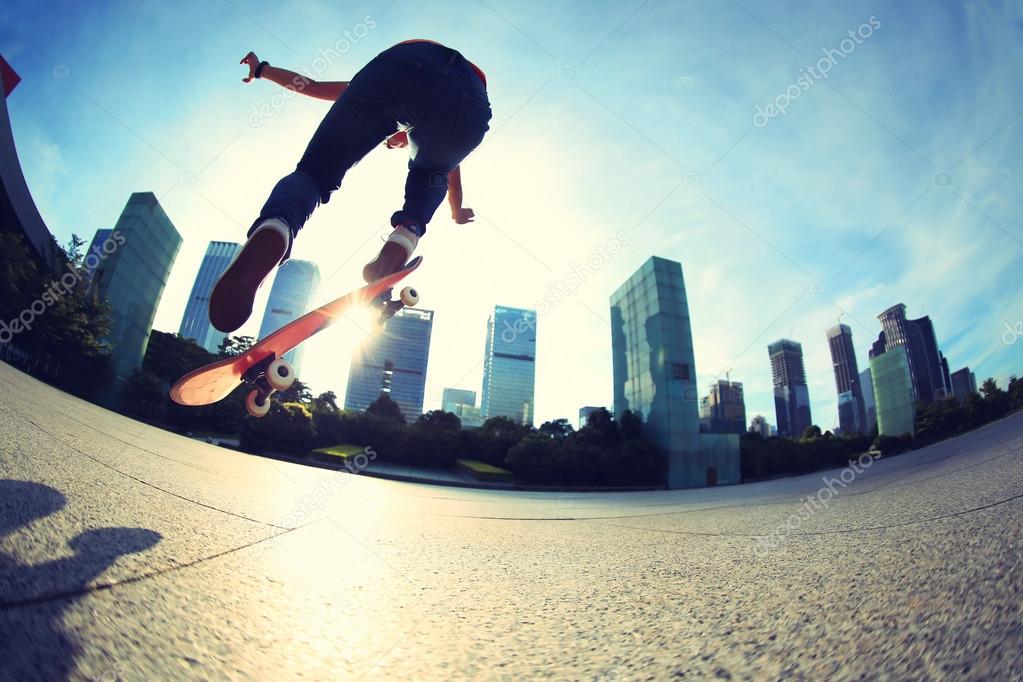 female skateboarding at city