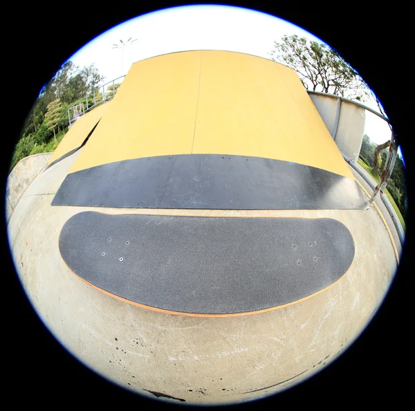 Skateboard over park ramp — Stock Photo, Image