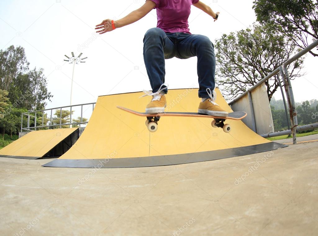 female Skateboarding at skatepark