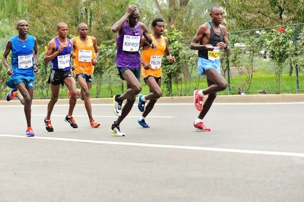 Marathon runners running on city road — Stock Photo, Image