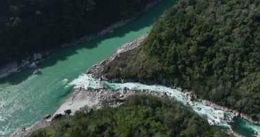 Aerial view of beautiful high altitude mountains, river and forest landscape