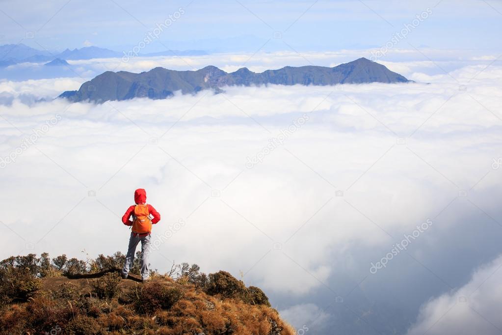 woman hiker on mountain peak