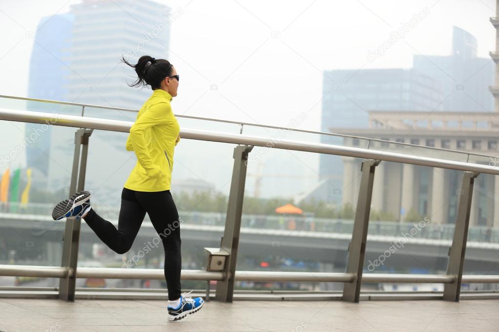 female running at shanghai city