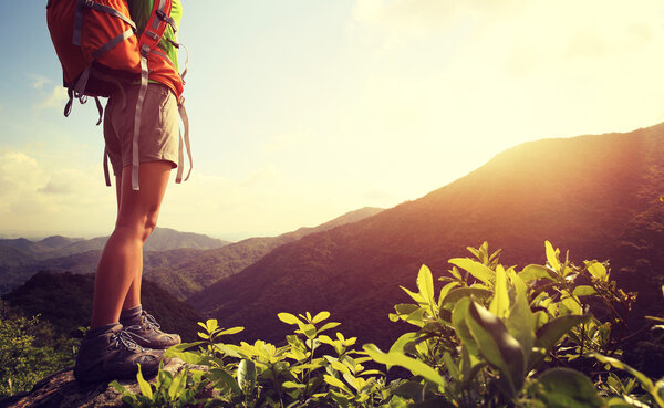 woman hiker on mountain peak