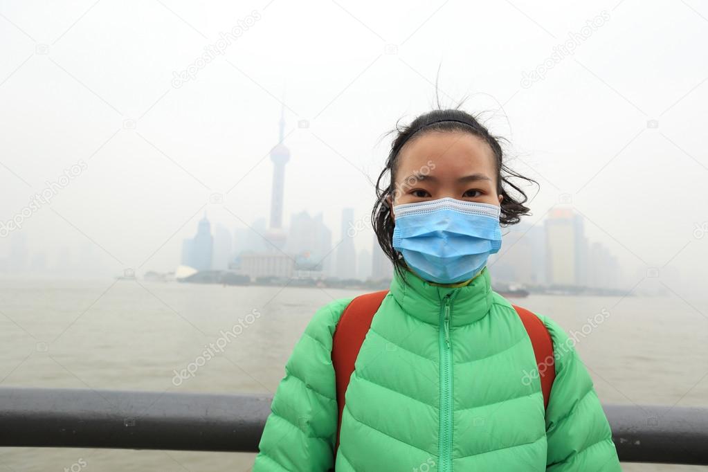 woman wear mask at  pollution city
