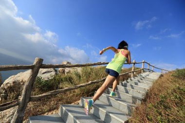 fitness woman running on stairs clipart