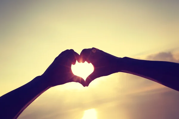 Hands making Heart shaped sign — Stock Photo, Image