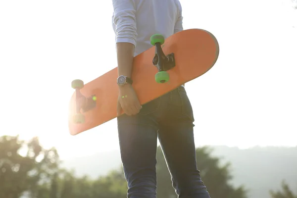 Female skateboarder with board — Stock Photo, Image