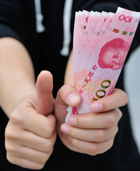 Hand with yuan money bills — Stock Photo, Image