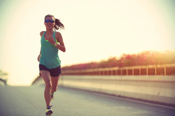 Woman runner running on road — Stock Photo, Image