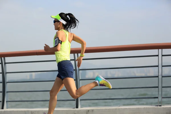 Woman runner running at seaside — Stock Photo, Image