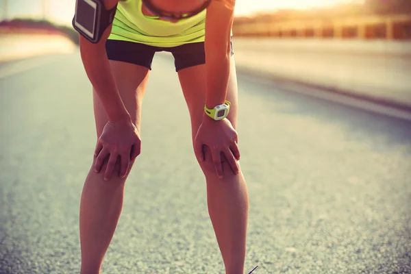 Tired woman runner taking rest — Stock Photo, Image