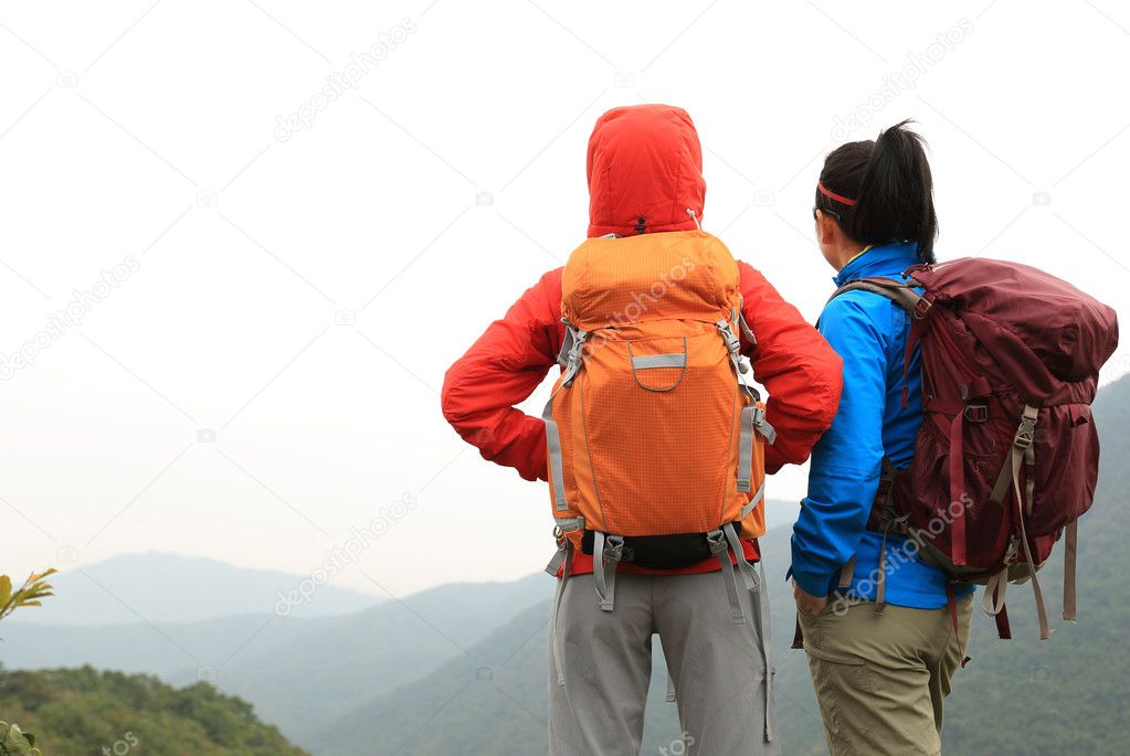 backpackers at mountain peak