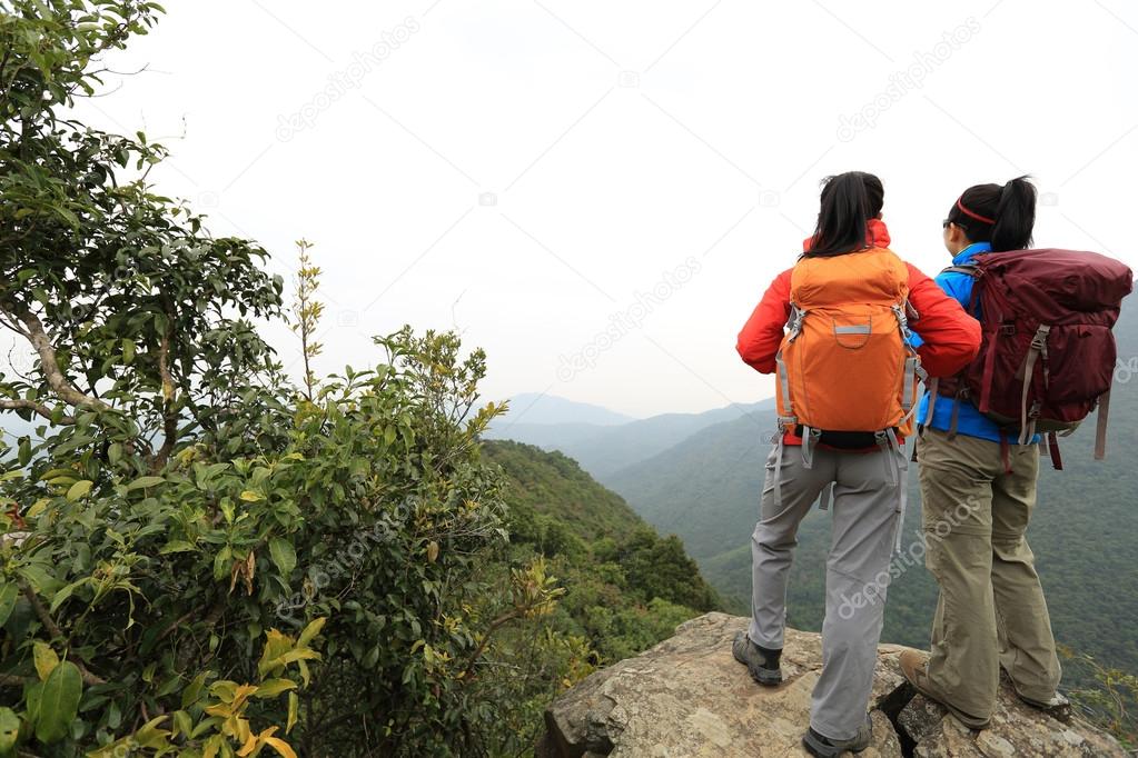 backpackers at mountain peak