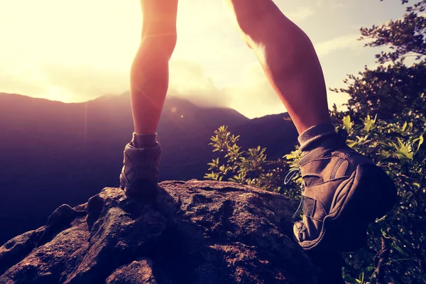Hiker legs onmountain peak — Stock Photo, Image