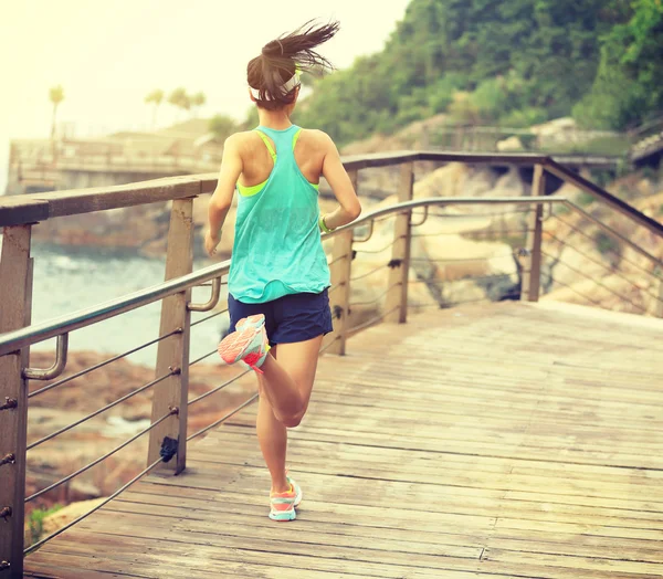 Fitness sporty woman on boardwalk — Stock Photo, Image