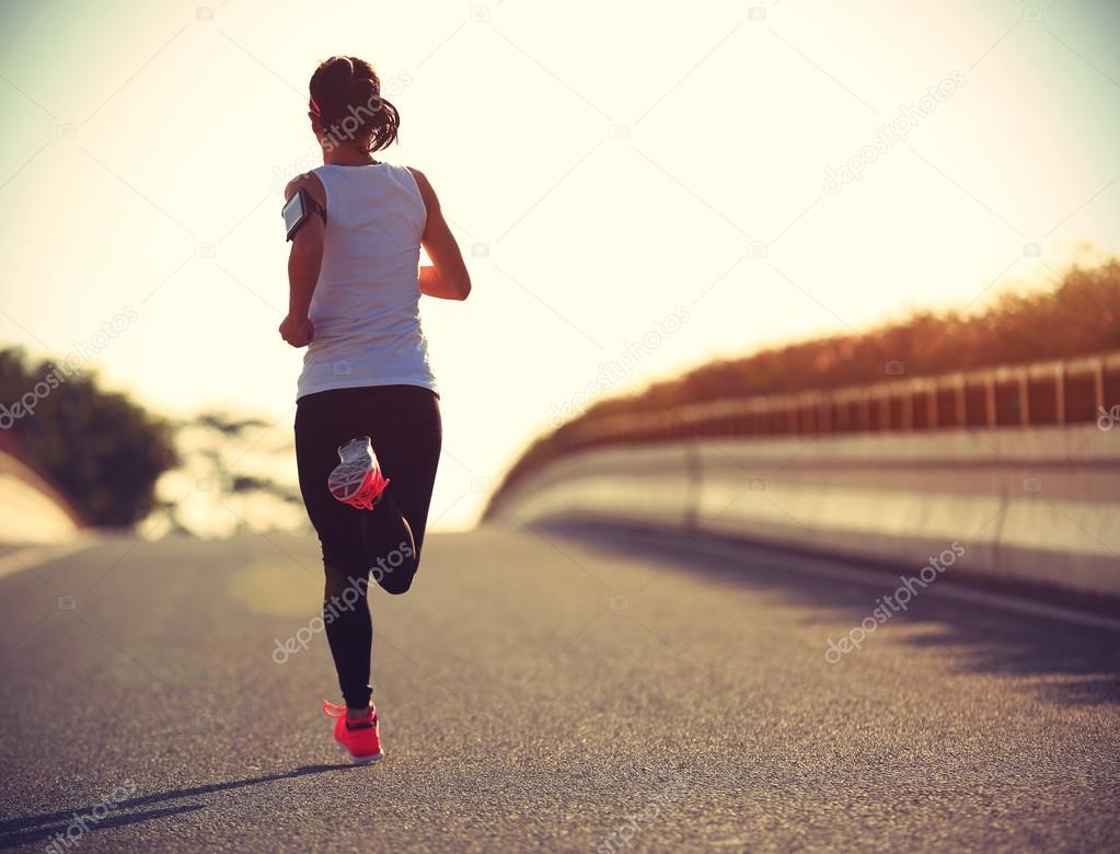 fitness woman running on road