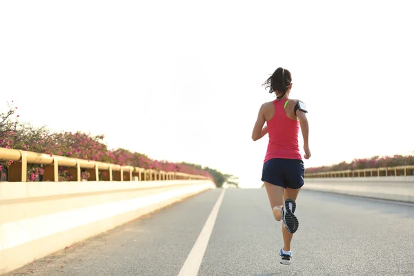 Woman runner running on road — Stock Photo, Image