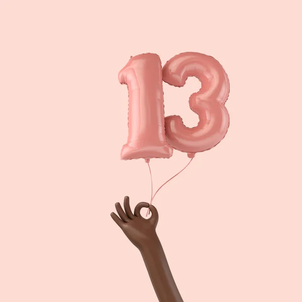 Main tenant un ballon de célébration en papier d'aluminium rose du 13e anniversaire. Rendu 3D — Photo