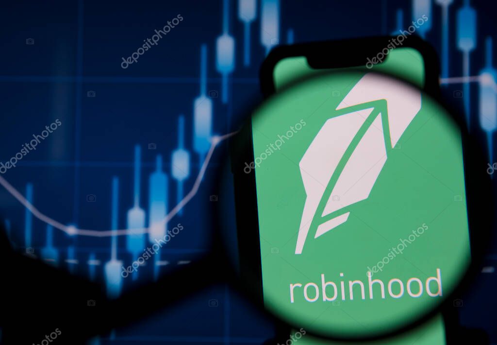 LONDON, UK - January 2021: Robinhood investing app under magnifying glass.