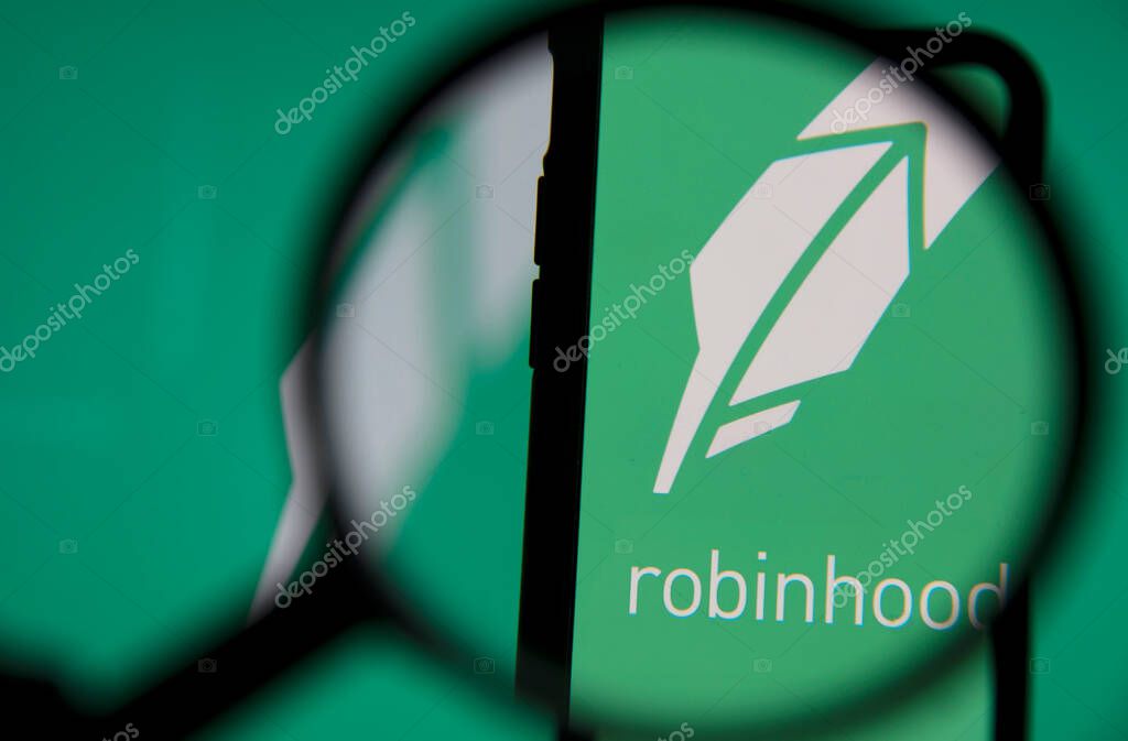 LONDON, UK - January 2021: Robinhood investing app under magnifying glass.