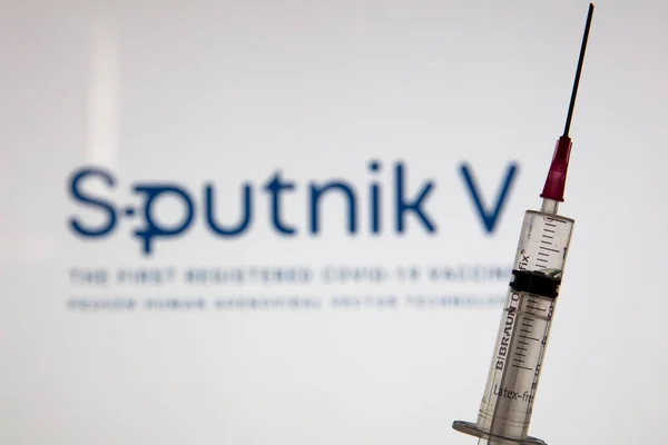 OXFORD, UK - February 2020: Sputnik V covid vacco logo with injection dochinge — 스톡 사진