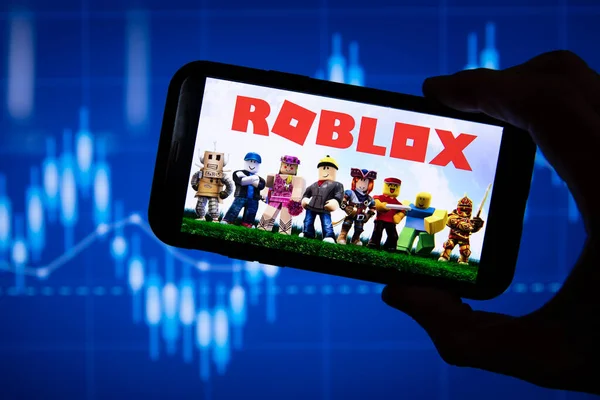 Roblox company logo on a website with blurry stock market developments in  the background, seen on a computer screen through a magnifying glass Stock  Photo - Alamy