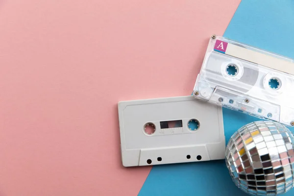 Retro disco glitter ball with a vintage cassette tape — Stock Photo, Image