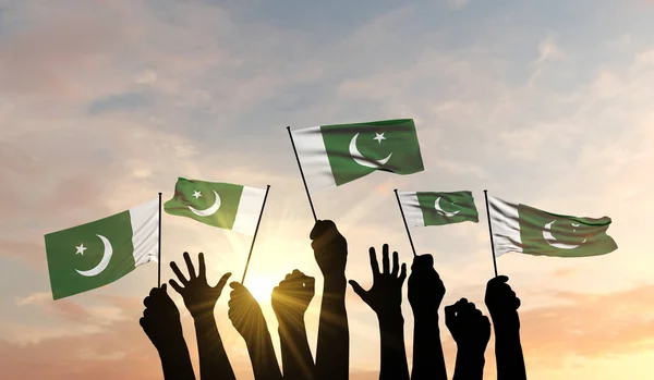 Silhuett av vapen höjde viftande en Pakistan flagga med stolthet. 3D-återgivning — Stockfoto