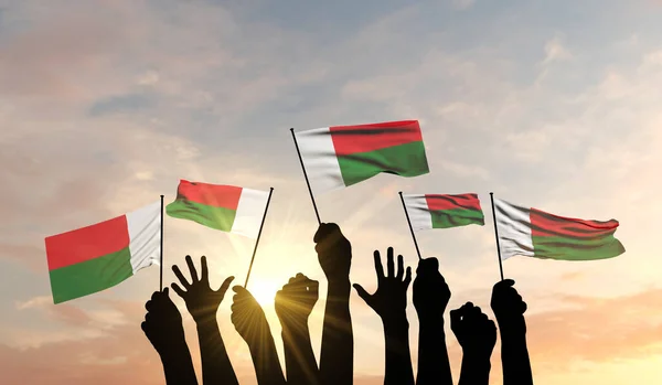 Wappensilhouette erhoben, stolz eine Madagaskar-Flagge schwenkend. 3D-Rendering — Stockfoto